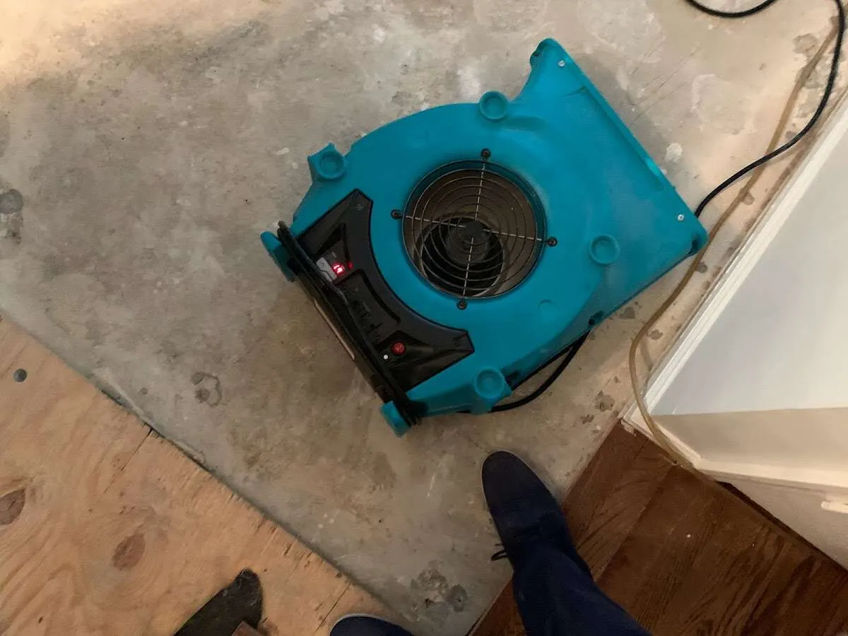 Air mover drying subfloor during Leak Detection & Repair in Santa Fe